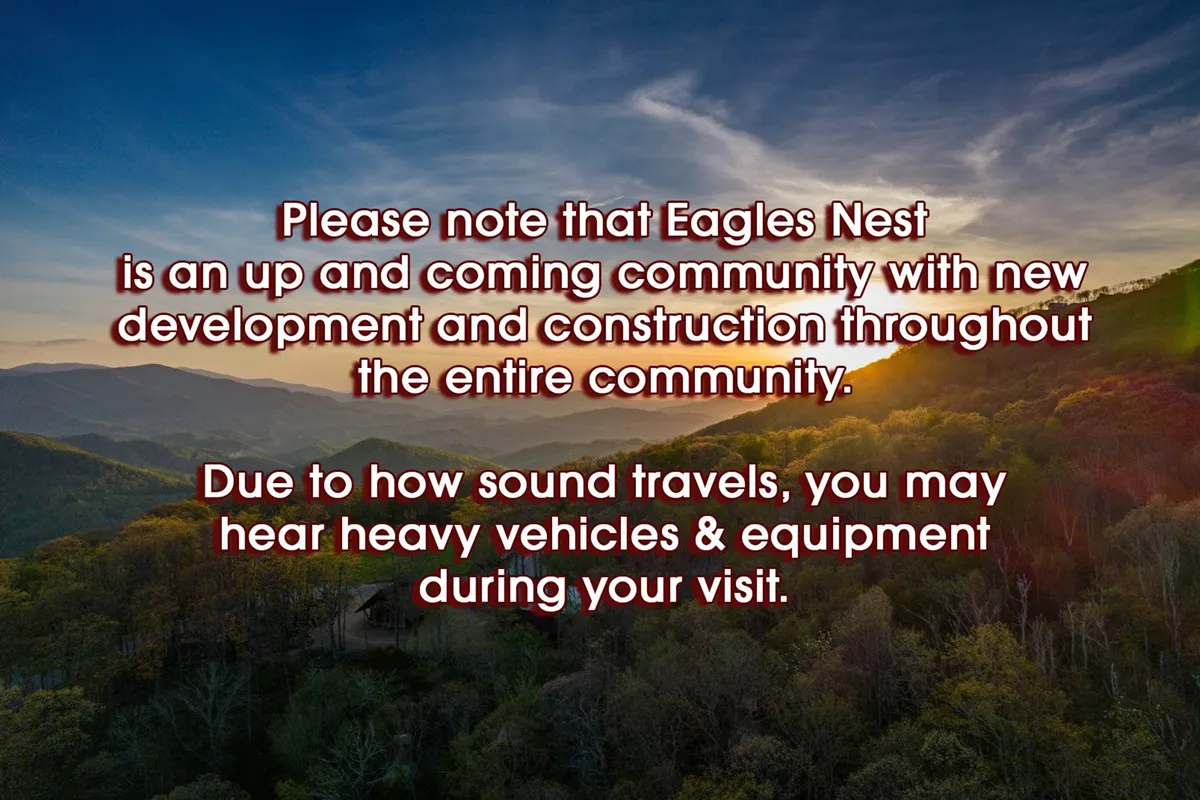 This image captures a sweeping mountain range beneath a vibrant sunset sky, surrounded by lush greenery in the foreground. The expansive view evokes the breathtaking landscape and sunset ambiance that typifies wine country and the Eagles Nest Winery experience.